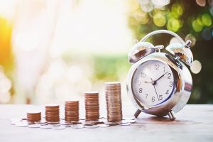 Coin stack and alarm clock