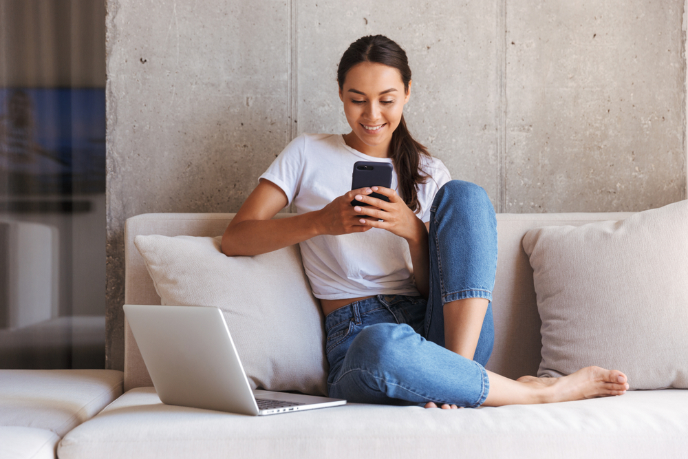 Happy Woman on Sofa - Cigno Loans