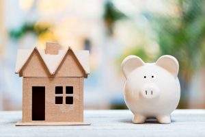 Piggy bank and house figure